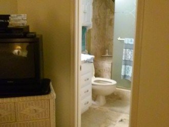Completed Master Walkin Shower in Travertine Marble with in shower seat