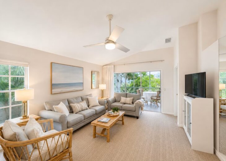 Living Room in a desirable end-unit condo, featuring additional side windows