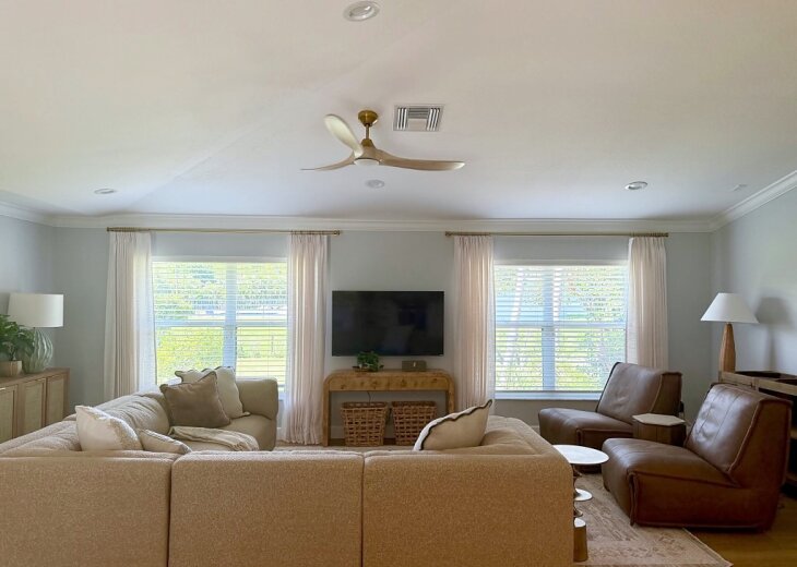Family room with sectional, leather recliners, and TV