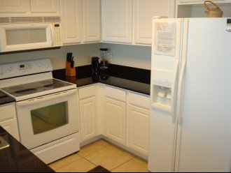Fully equipped kitchen w/ granite counter tops & lots of counter space