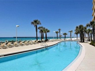 Poolside view of the beach, rolling Gulf COast & the City Pier all in 1 view