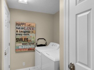Convenient in-unit laundry room with full size washer & dryer