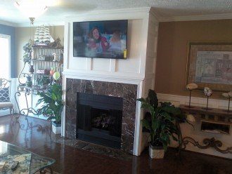 Fire place with flat screen tv in living room