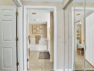 Two large closets lead to large private bath area