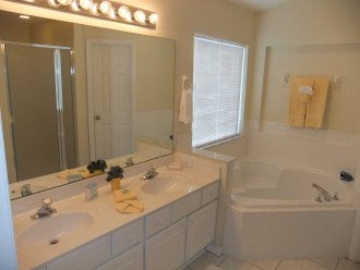 One of two bathrooms, this one with large tub and walk in shower