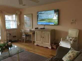 65" TV and desk in livingroom