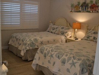 Guest room with two full sized beds