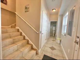 1st Floor Entry - Elevator is door to the left, full bath ahead, & entry right