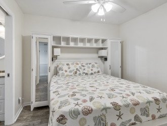 Bedroom with ceiling fan and cable TV