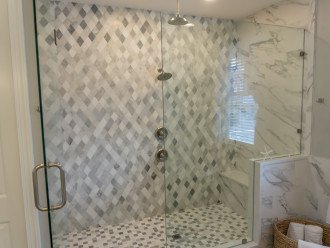 Moen waterfall showers, mosaic tile , a welcome treat after a day at the beach