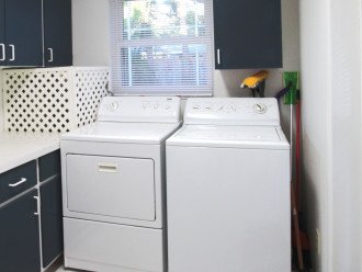 Laundry room with storage.