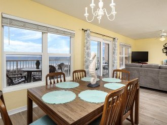 Dining area with views of the beach and pool
