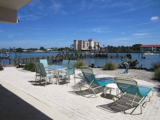 Enjoy water views from private beach patio area right on Intercoastal waterway