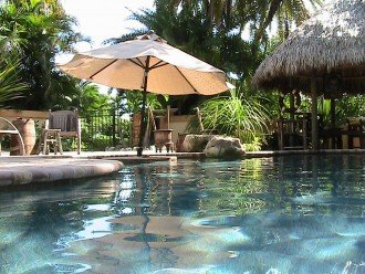 Swim up cocktail table with umbrella.