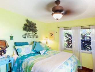 2nd bedroom has a king size bed with views of the lagoon pool and open water.