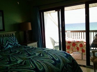 View from MBR to beach deck w/umbrella, chaise, table, chairs, WiFi