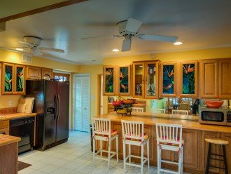 The colorful Key West kitchen is fully stocked has all the modern conveniences.