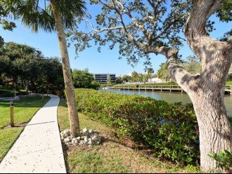 Walk way behind condo next to the water and docks
