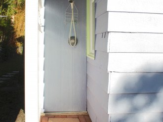 Outdoor shower with hot and cold water - rinse off the beach sand here.