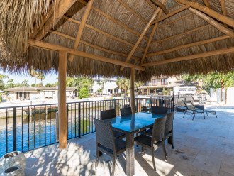 Walk to the Beach Coral Reef Tiki Hut Waterfront 4 bedroom heated pool home! #1