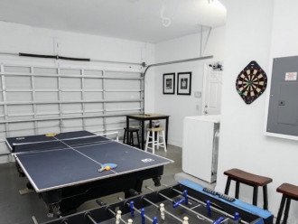 Games room with dartboard, table tennis and table football