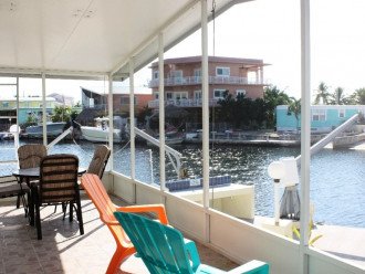 Relax in our wonderful screened patio overlooking the water