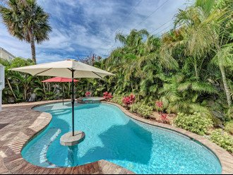 Enjoy the all-day sun in this stunning professionally landscaped private backyard
