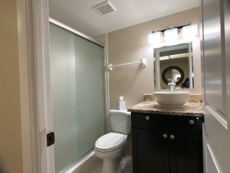 Master bath features a walk-in shower, granite counter, fluffy white towels!