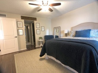 Master suite features extra soft memory foam, linens, lamps and fan remote