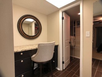 The master suite features a walk-in closet and elegant dressing table.