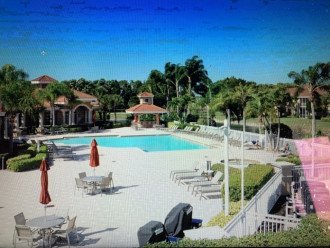 Clubhouse Pool with Spa, Tiki Bar, BBQ Grills and many loungers and tables.