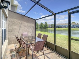 Screened patio with table and chairs