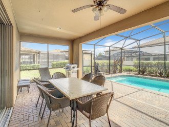 Patio table with chairs and BBQ grill
