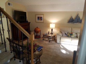 Living Room from front entry. Lower stairs have rail on one side