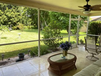 Screened lanai with sofa- watch the sunsets- or dine outside- table & chairs