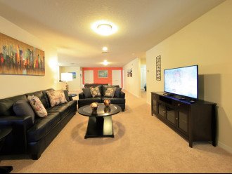 Family Room with leather sofa and cable TV