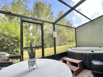 Private screened patio with hot tub