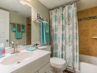 Guest bath with tub and shower.