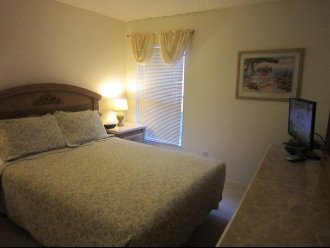Queen Bedroom with en-suite Bathroom, widescreen TV, closet space.