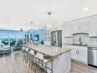 Large comfortable fully stocked kitchen with a 9' granite island and a VIEW!