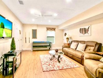 Spacious family sitting area with large TV