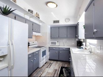 Kitchen, refrigerator with ice maker and water dispenser.