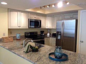 Spacious counter space within fully equipped kitchen