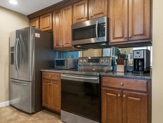 Kitchen has all stainless steel appliances.