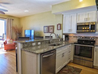 UPDATED KITCHEN with shaker cabinets, granite and stainless appliances