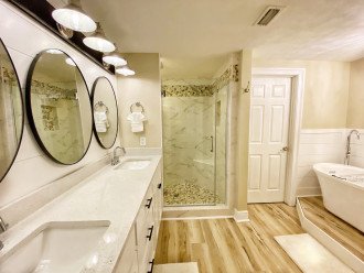 Tile shower, shaker doors, stand alone tub and quartz counters
