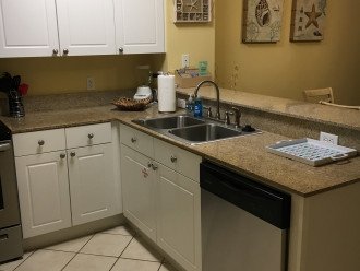 Kitchen showing dishwasher.