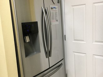 Refrigerator showing water & ice dispenser. Lower freezer also makes ice.