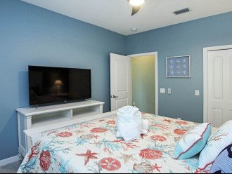 Queen guest room with 45" HD Smart TV and streaming.