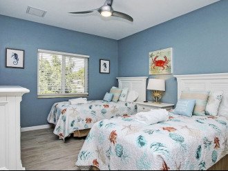 Twin guest bedroom decorated in ocean decor